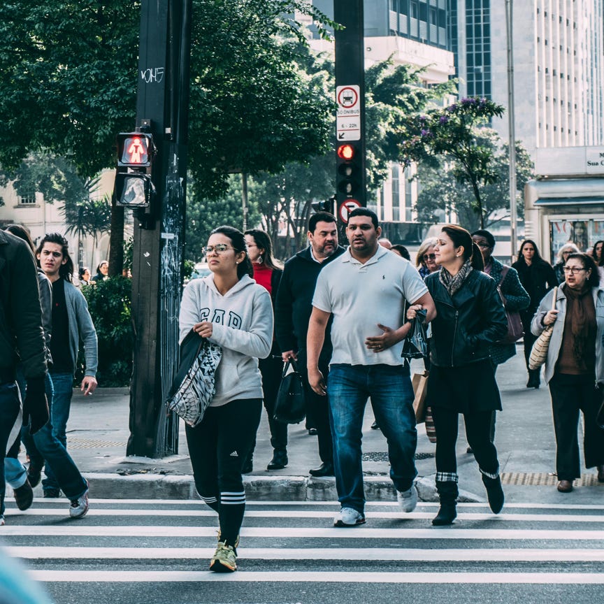 People Walking on Pedestrian Lane during Daytime